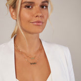 14k Yellow Gold Personalized Gothic Name Necklace on woman's neck